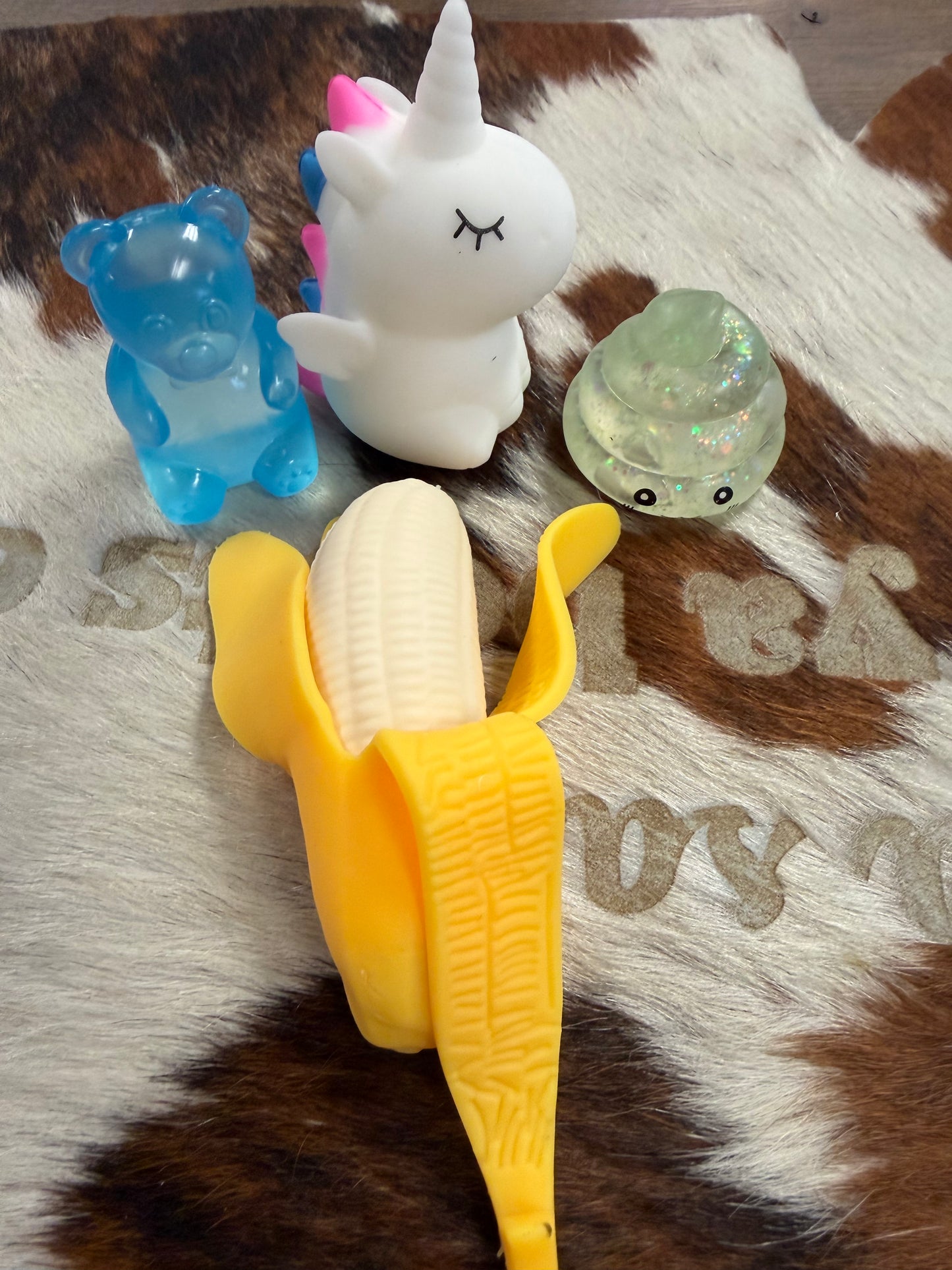 SQUISHIES- POOP, BANANA,UNICORN,GUMMY BEAR